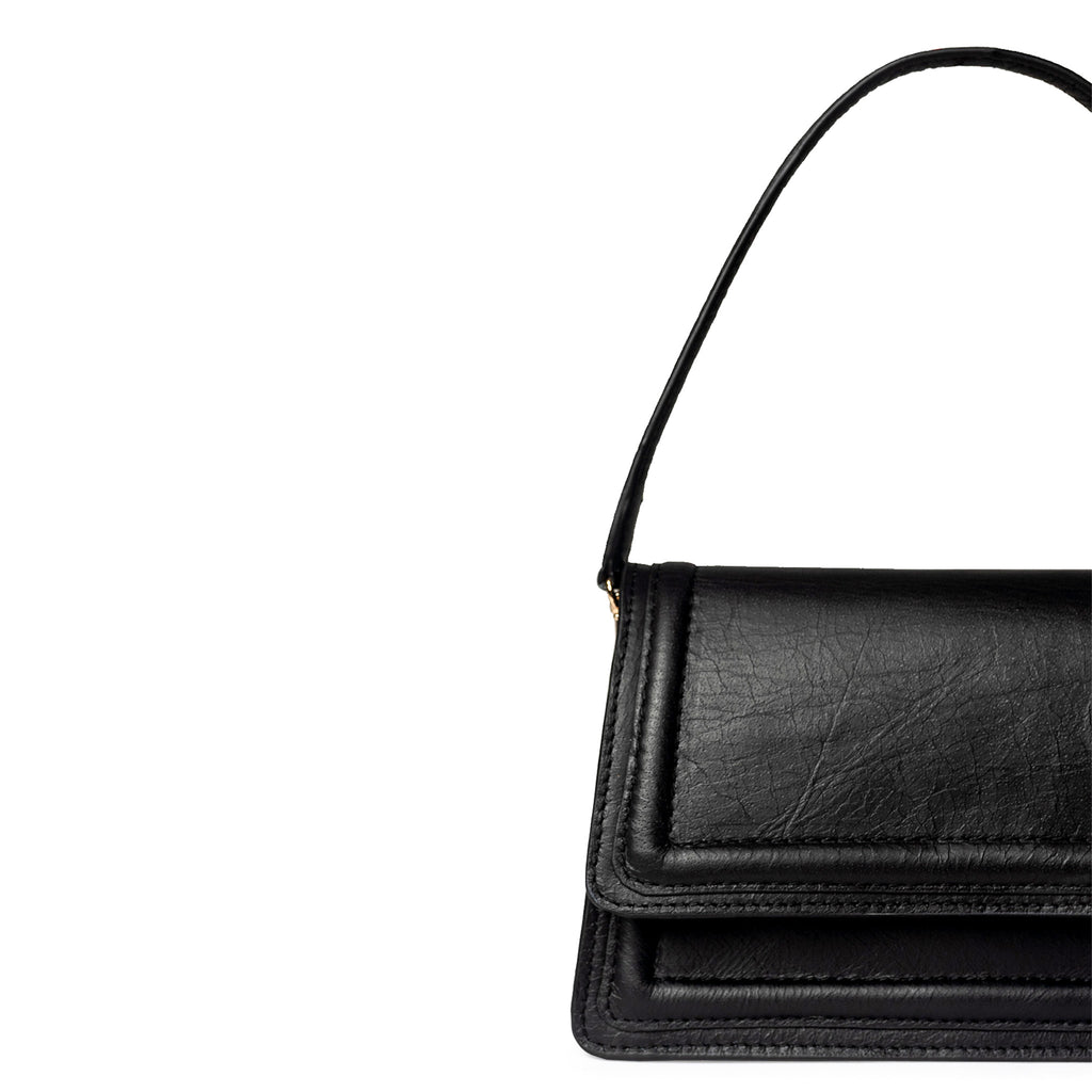 Black leather mini crossbody bag handmade from upcycled leather in Delhi, India